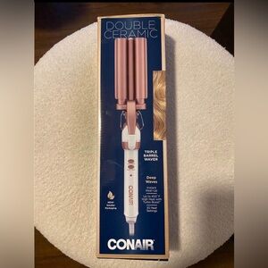 double ceramic barrrl curling iron 
BRAND NEW IN BOX…. HUGE PRICE SLASH!!!